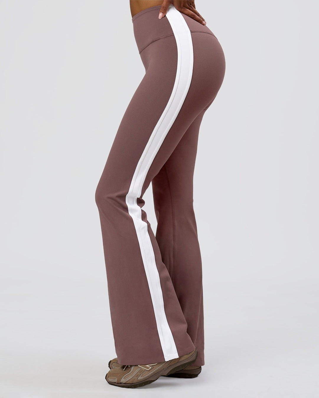 Woman wearing Fusion V-Contour Bind High-Rise Flared Legging - Cocoa Power-White | Model:Jordan | Size:S - view 1