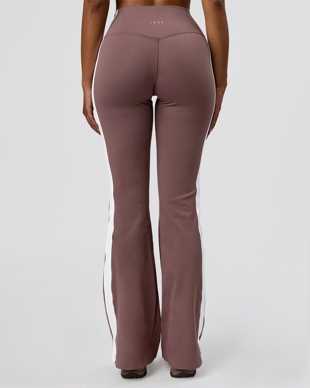 Woman wearing Fusion V-Contour Bind High-Rise Flared Legging - Cocoa Power-White | Model:Jordan | Size:S - view 11