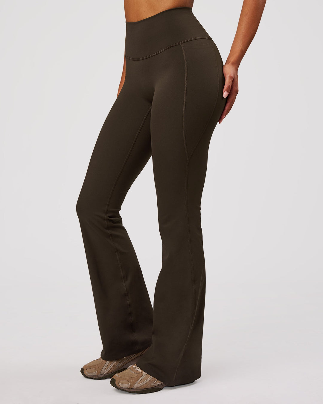 Woman wearing Fusion V-Contour High-Rise Flared Legging Pockets - Ground Coffee | Model:Jordan | Size:S - view 1