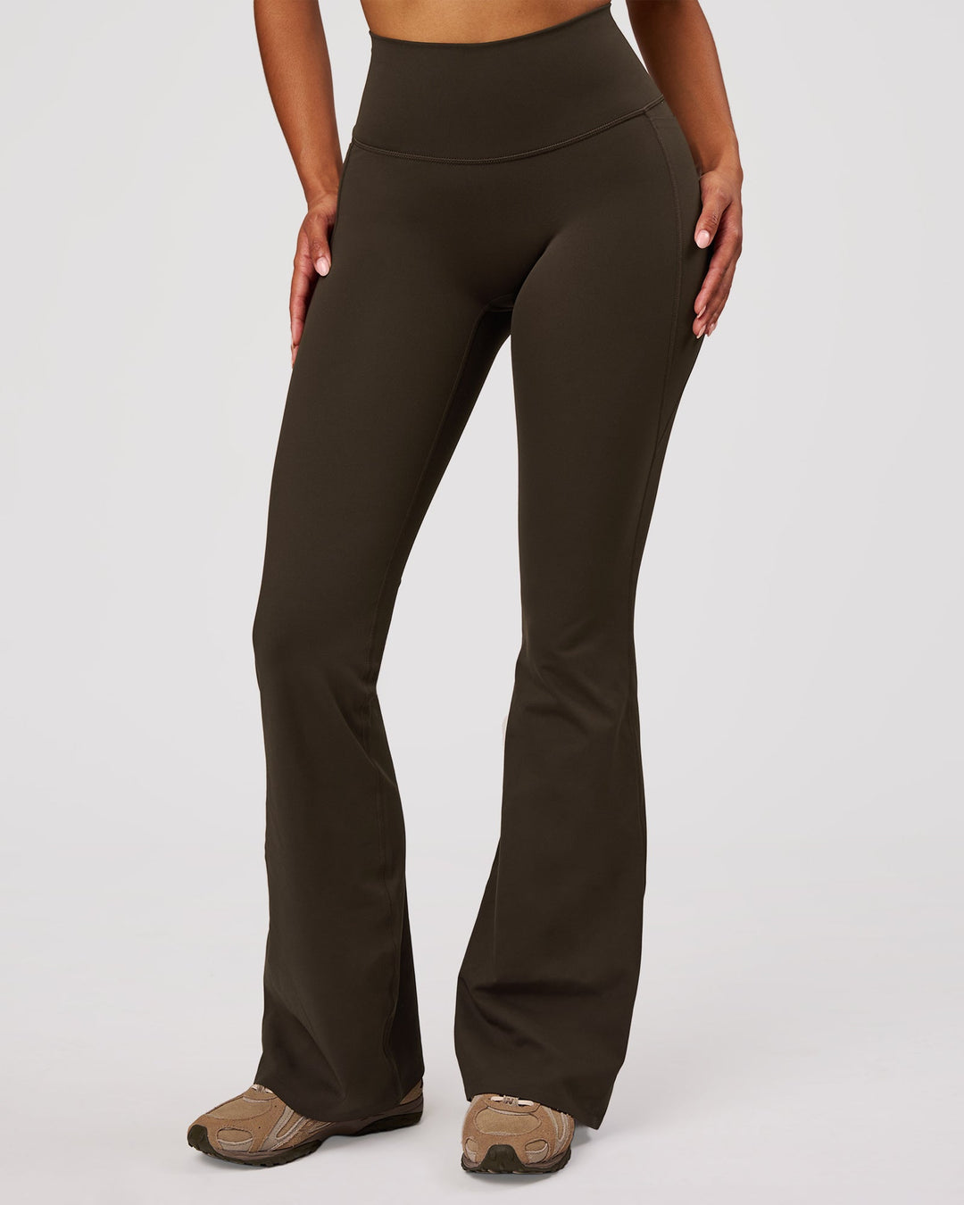 Woman wearing Fusion V-Contour High-Rise Flared Legging Pockets - Ground Coffee | Model:Jordan | Size:S - view 9
