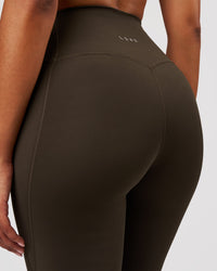 Woman wearing Fusion V-Contour High-Rise Flared Legging Pockets - Ground Coffee | Model:Jordan | Size:S | Thumbnail Index: 4