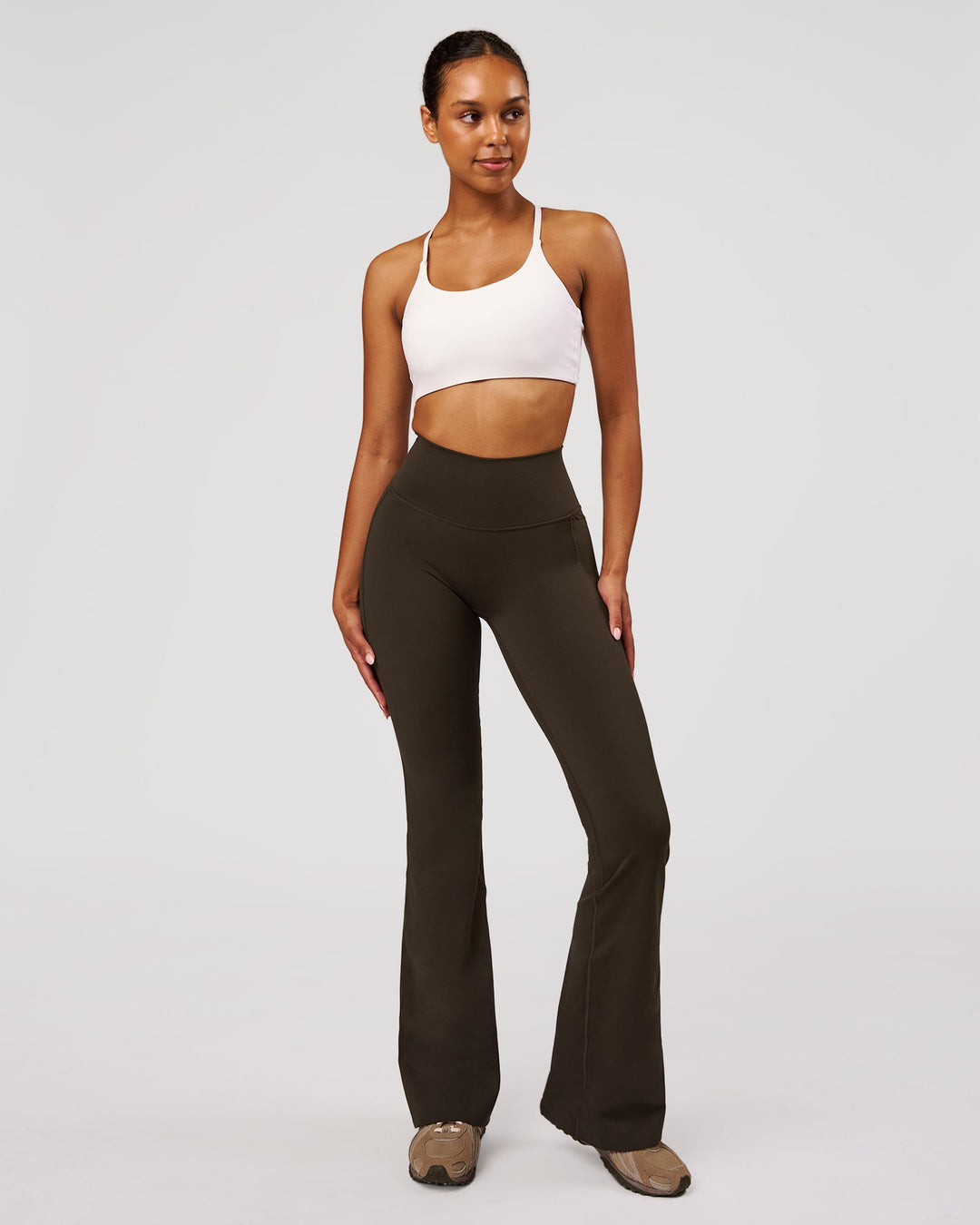 Woman wearing Fusion V-Contour High-Rise Flared Legging Pockets - Ground Coffee | Model:Jordan | Size:S - view 4