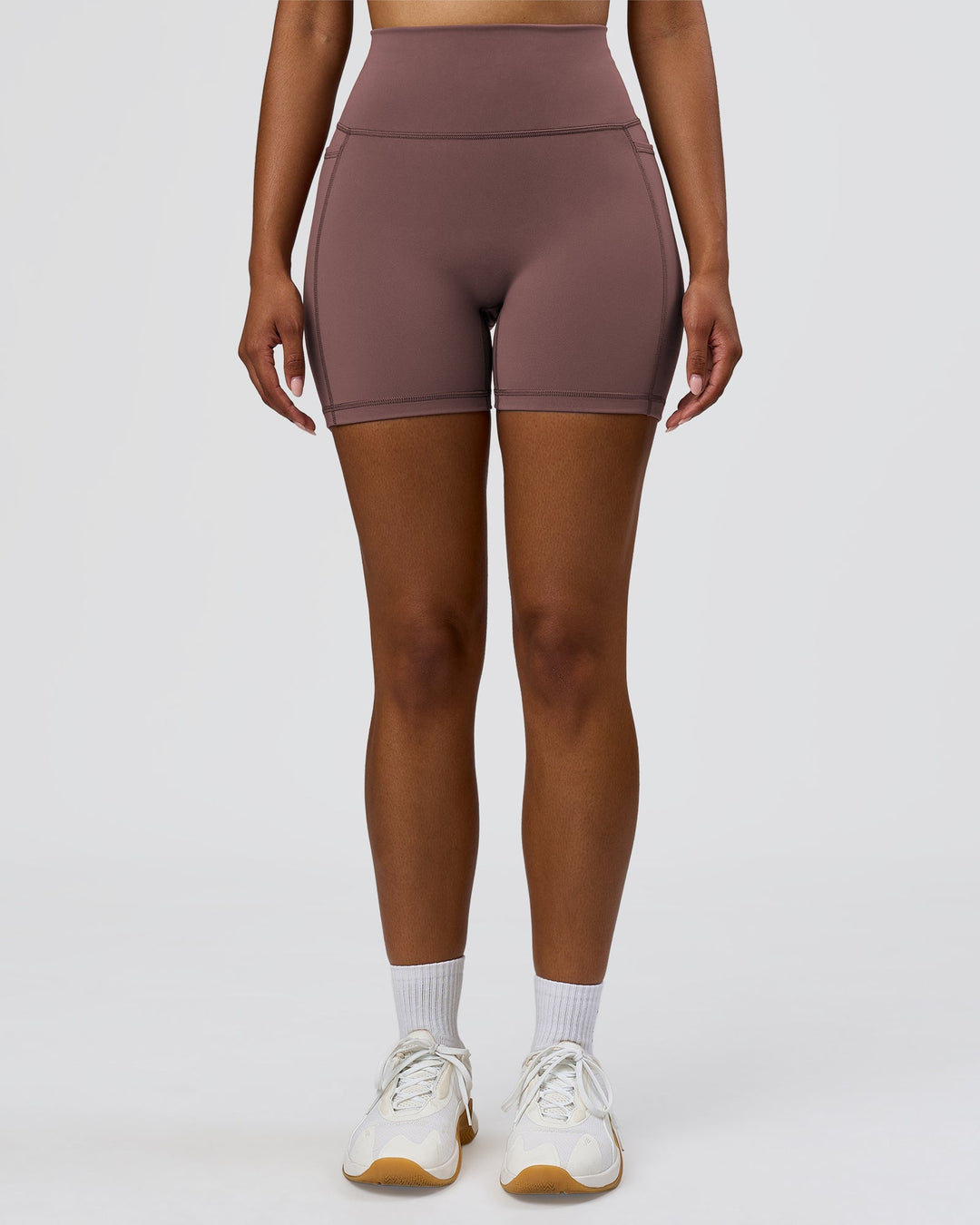 Woman wearing Fusion V-Contour Ultra High-Rise 6" Short Pockets - Cocoa Powder | Model:Jordan | Size:S - view 6