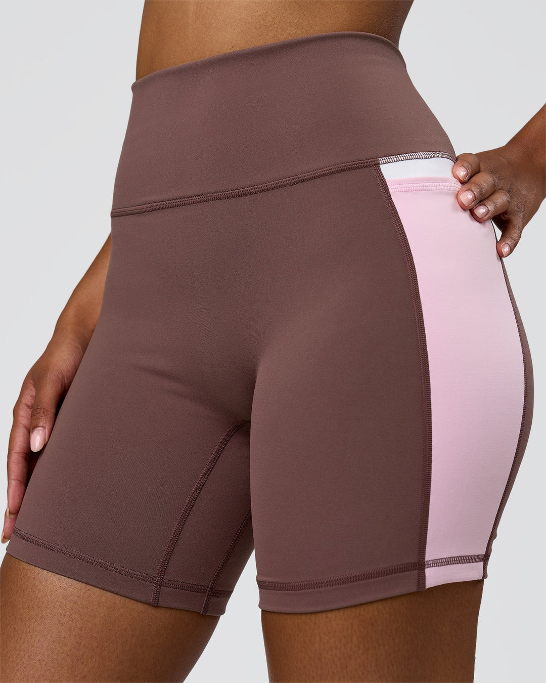Woman wearing Fusion V-Contour Ultra High-Rise 6" Short Pockets - Cocoa Powder-Marshmallow-White | Model:Jordan | Size:S - view 2