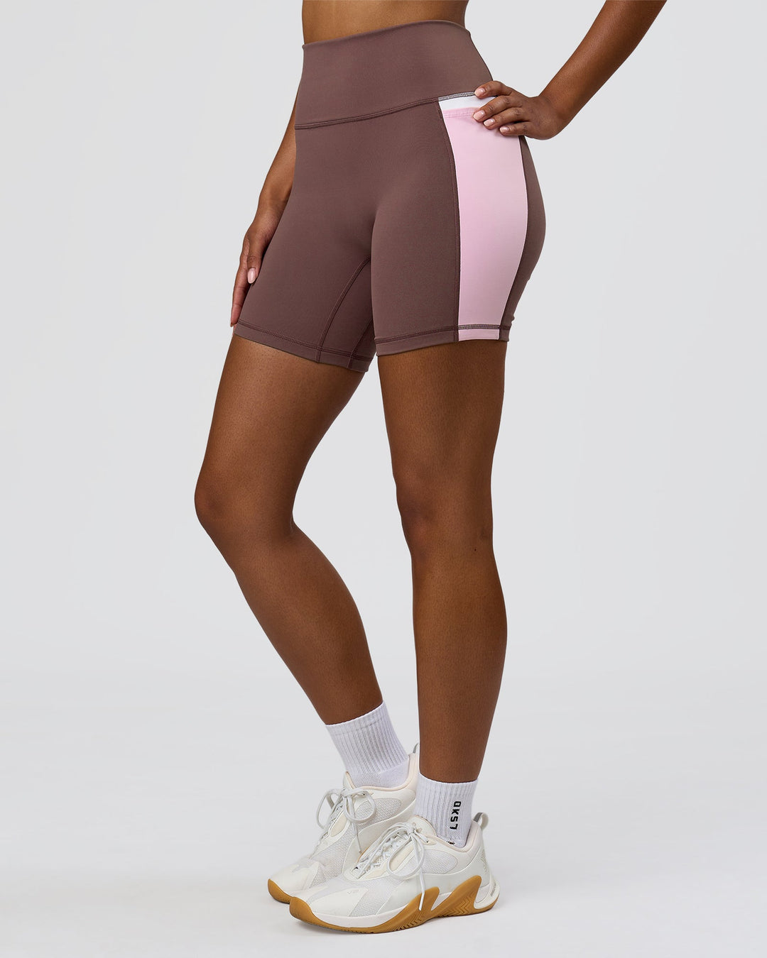 Woman wearing Fusion V-Contour Ultra High-Rise 6" Short Pockets - Cocoa Powder-Marshmallow-White | Model:Jordan | Size:S - view 3