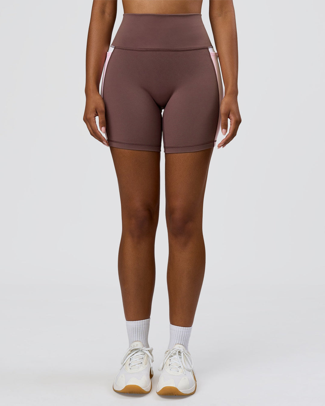 Woman wearing Fusion V-Contour Ultra High-Rise 6" Short Pockets - Cocoa Powder-Marshmallow-White | Model:Jordan | Size:S - view 6