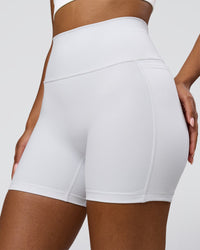 Woman wearing Fusion V-Contour Ultra High-Rise 6" Short Pockets - White | Model:Jordan | Size:S | Thumbnail Index: 2