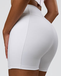 Woman wearing Fusion V-Contour Ultra High-Rise 6" Short Pockets - White | Model:Jordan | Size:S | Thumbnail Index: 3