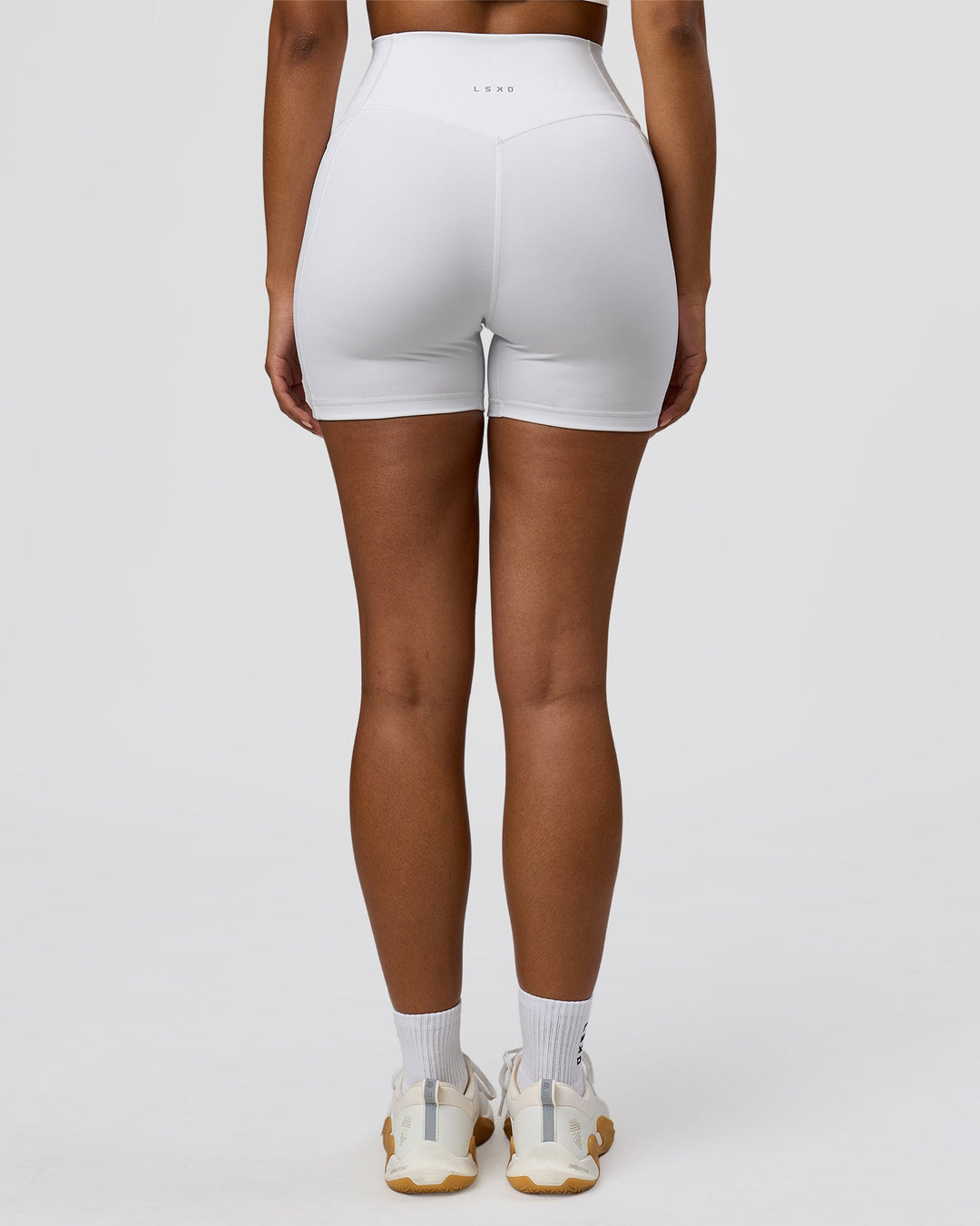 Woman wearing Fusion V-Contour Ultra High-Rise 6" Short Pockets - White | Model:Jordan | Size:S - view 5