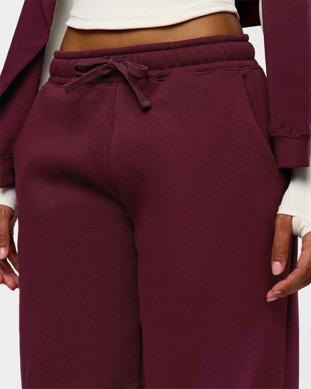 Woman wearing Go-To Oversized Track Pant - Cherry Lacquer | Model:Jordan | Size:S - view 7