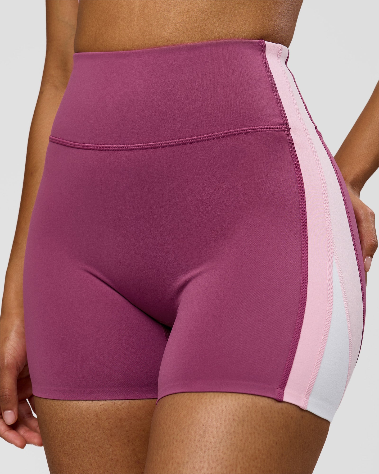 Woman wearing Revitalise Ultra High-Rise 4" Short - Boysenberry - Pink Rose | Model:Jordan | Size:S