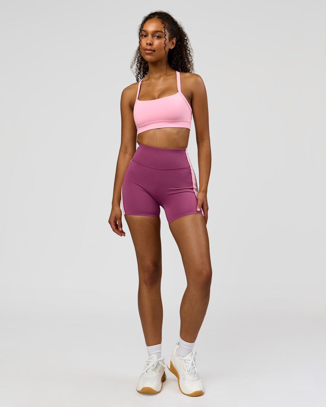 Woman wearing Revitalise Ultra High-Rise 4" Short - Boysenberry - Pink Rose | Model:Jordan | Size:S - view 7
