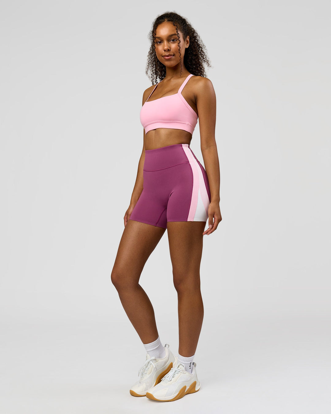 Woman wearing Revitalise Ultra High-Rise 4" Short - Boysenberry - Pink Rose | Model:Jordan | Size:S - view 5