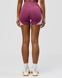 Woman wearing Revitalise Ultra High-Rise 4" Short - Boysenberry - Pink Rose | Model:Jordan | Size:S | Thumbnail Index: 10
