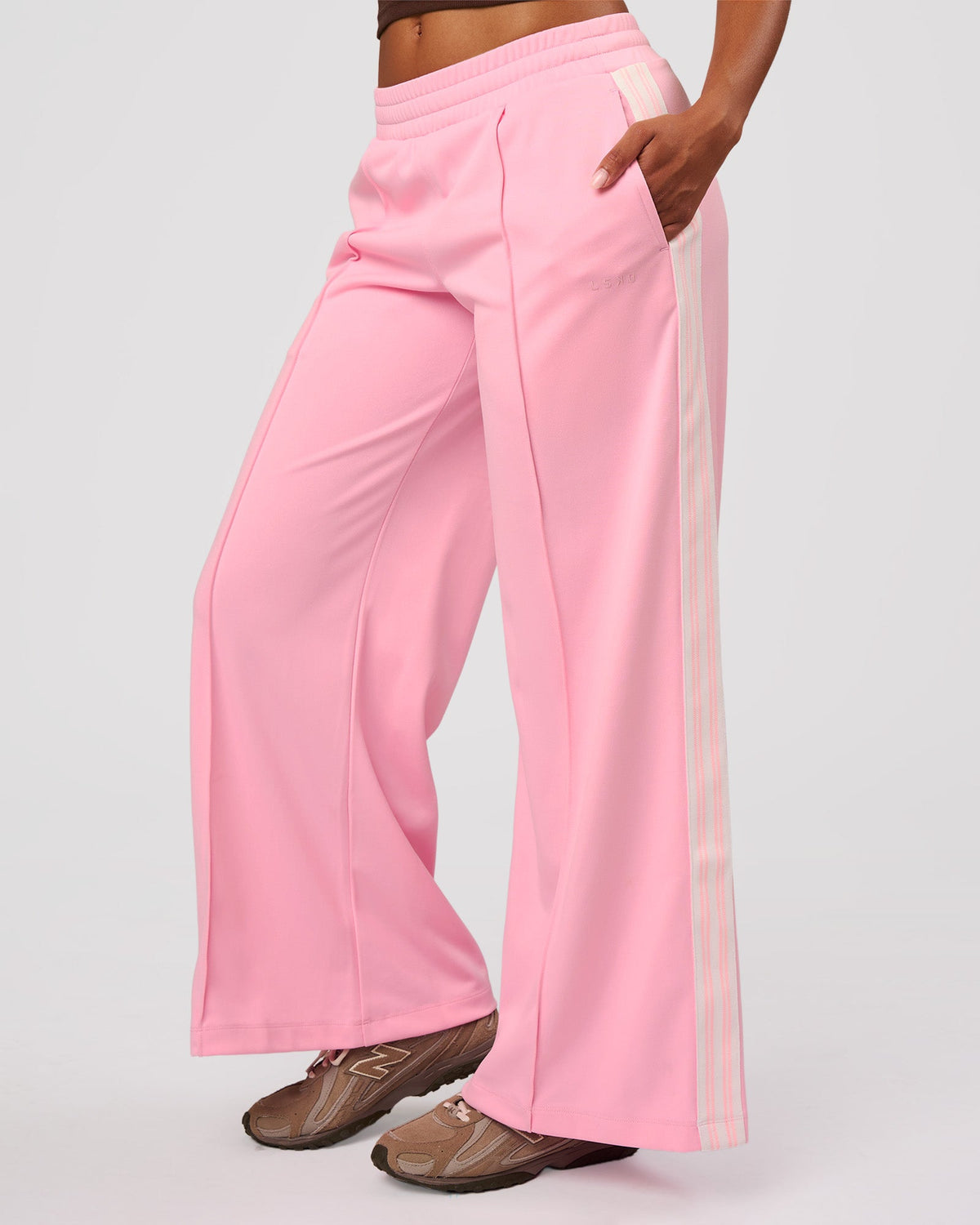 Woman wearing Urban Wide Leg Track Pant - Pink Rose | Model:Jordan | Size:S