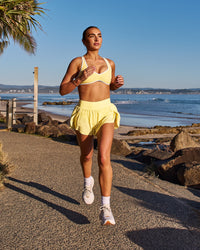 Woman wearing Luminous Sports Bra - Lemon-White | Model:Libby | Size:S | Thumbnail Index: 8