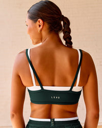 Woman wearing Balance Sports Bra - Midnight Green-White | Model:Meg | Size:S | Thumbnail Index: 8