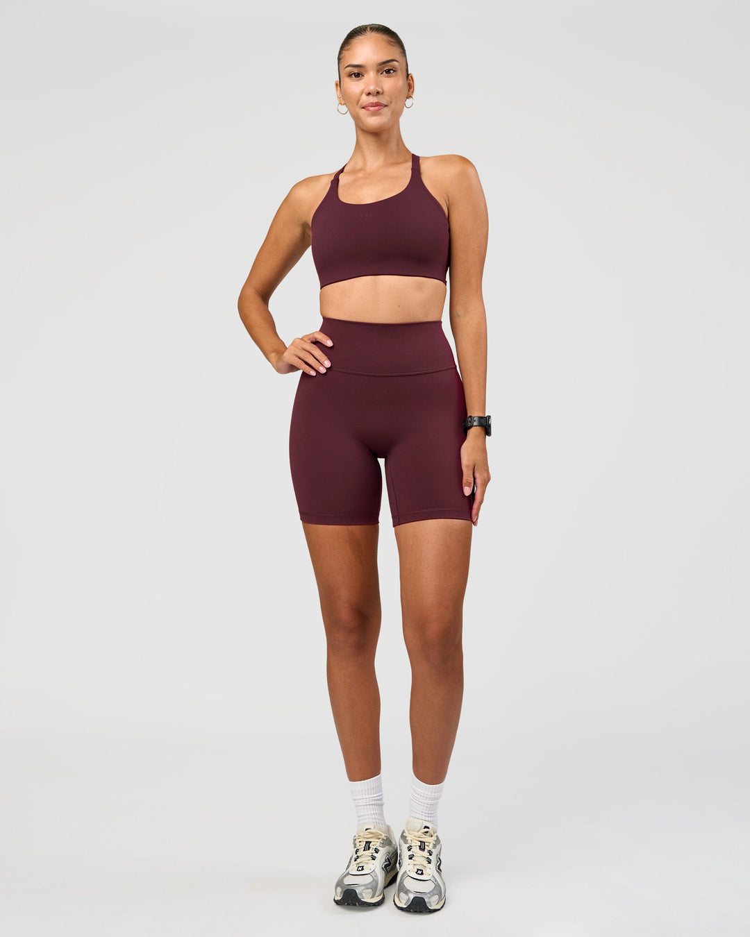 Woman wearing Twist Sports Bra D/DD/E - Cherry Lacquer | Model:Rhiley | Size:S - view 3