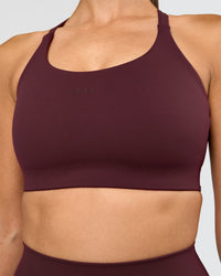 Woman wearing Twist Sports Bra D/DD/E - Cherry Lacquer | Model:Rhiley | Size:S | Thumbnail Index: 0