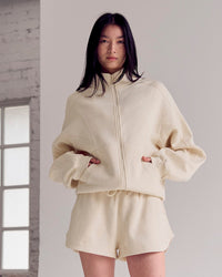 Woman wearing Bree Oversized Fleece Zip Thru - Vanilla Bean | Model:Rianna | Size:S | Thumbnail Index: 1