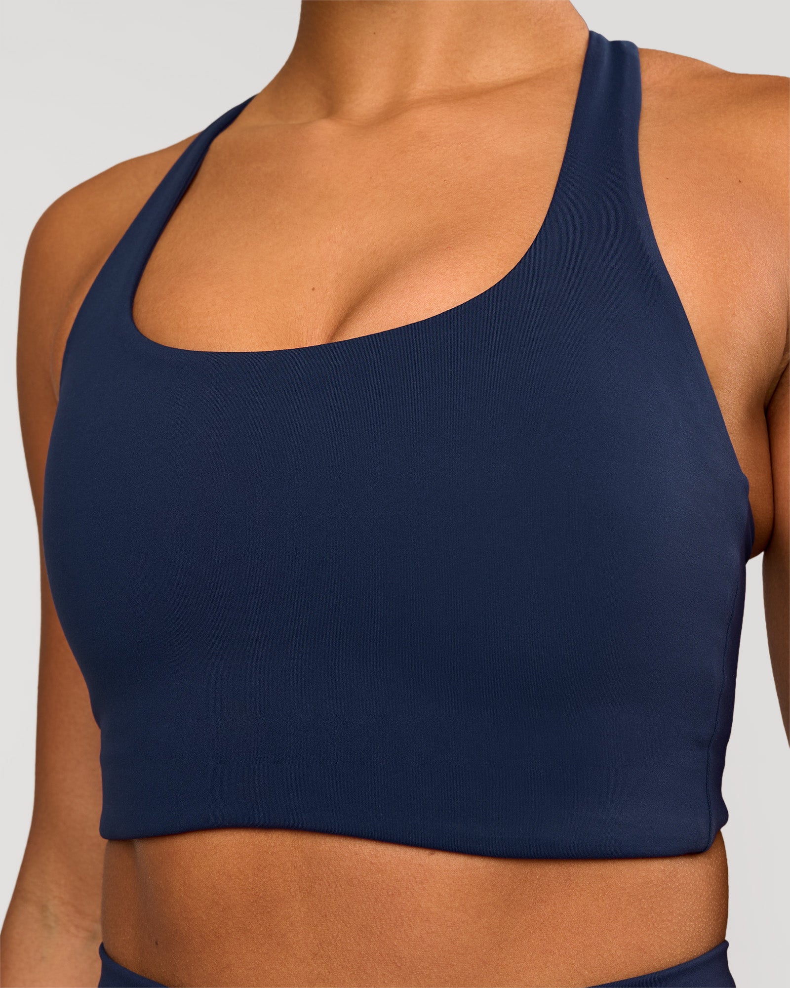 Woman wearing Flow Long Line Sports Bra - Future Navy | Model:Rosie | Size:S