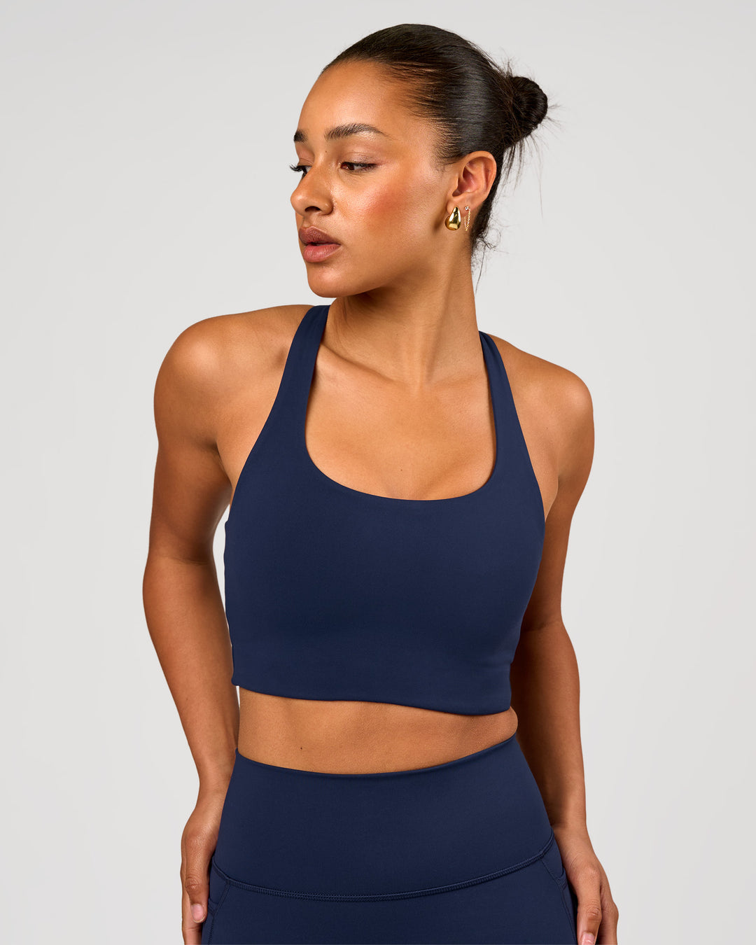Woman wearing Flow Long Line Sports Bra - Future Navy | Model:Rosie | Size:S - view 1