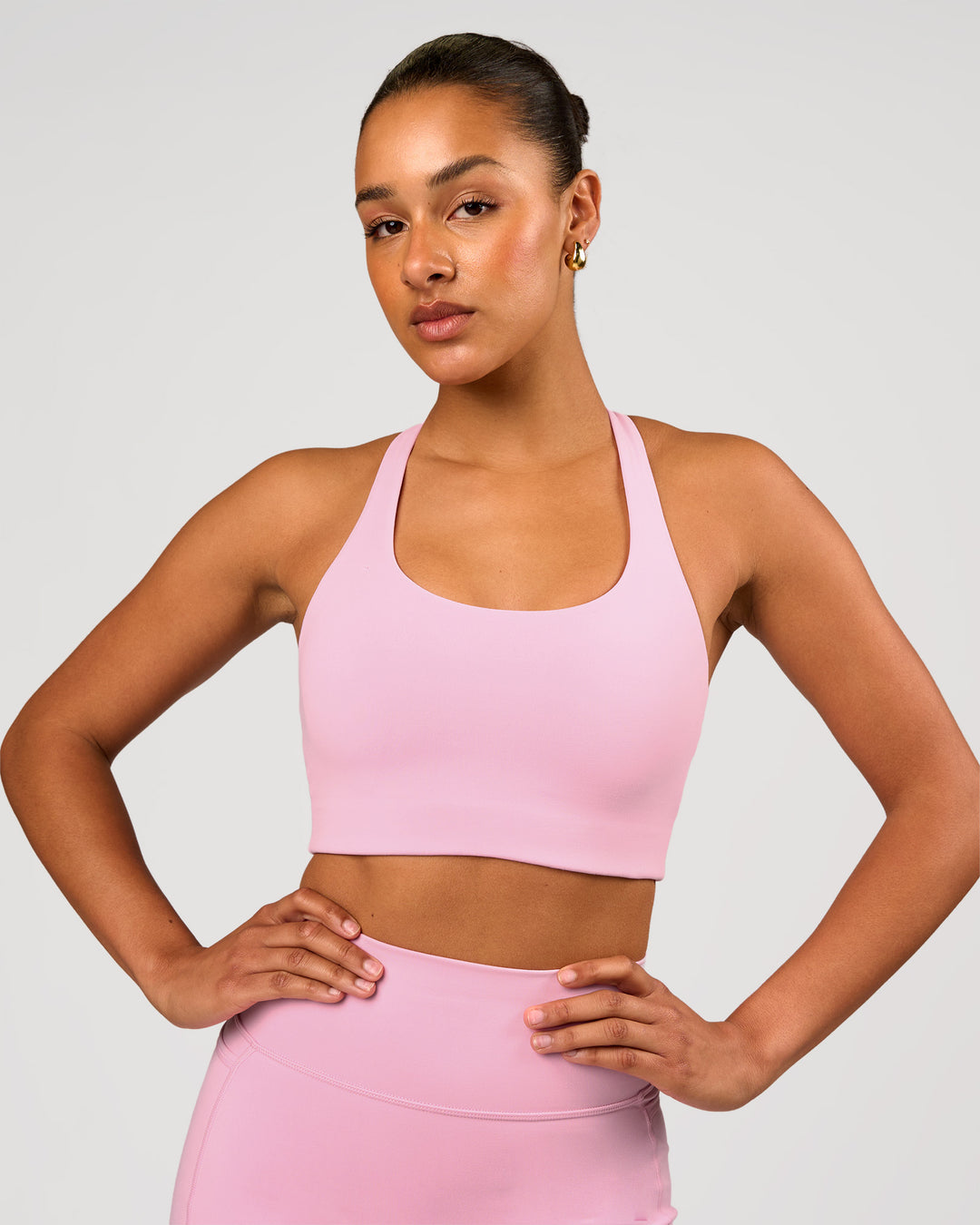 Woman wearing Flow Long Line Sports Bra - Pink Rose | Model:Rosie | Size:S - view 1