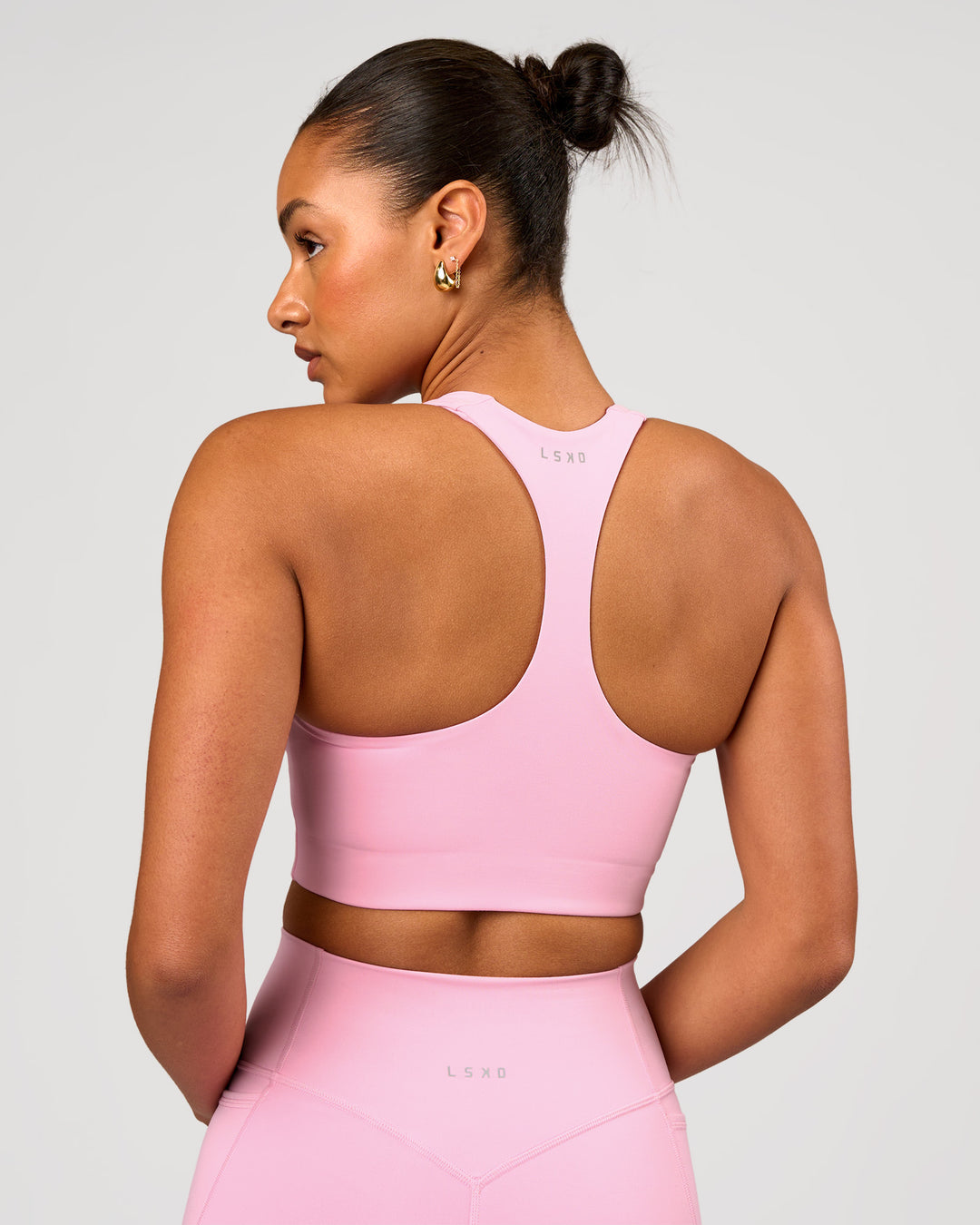 Woman wearing Flow Long Line Sports Bra - Pink Rose | Model:Rosie | Size:S - view 2