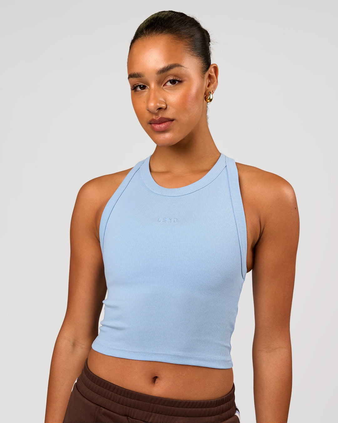 Woman wearing Go-To FLXCotton Rib Crop Tank - Open Air | Model:Rosie | Size:S - view 1