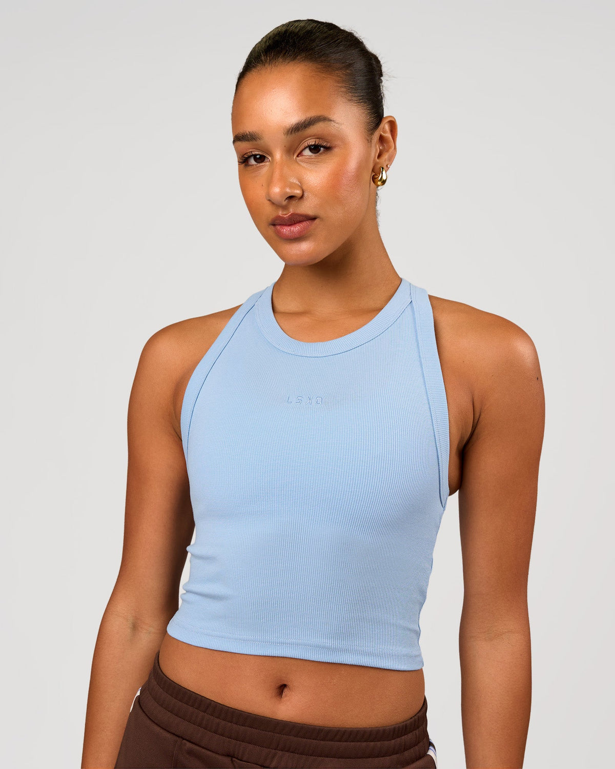 Woman wearing Go-To FLXCotton Rib Crop Tank - Open Air | Model:Rosie | Size:S