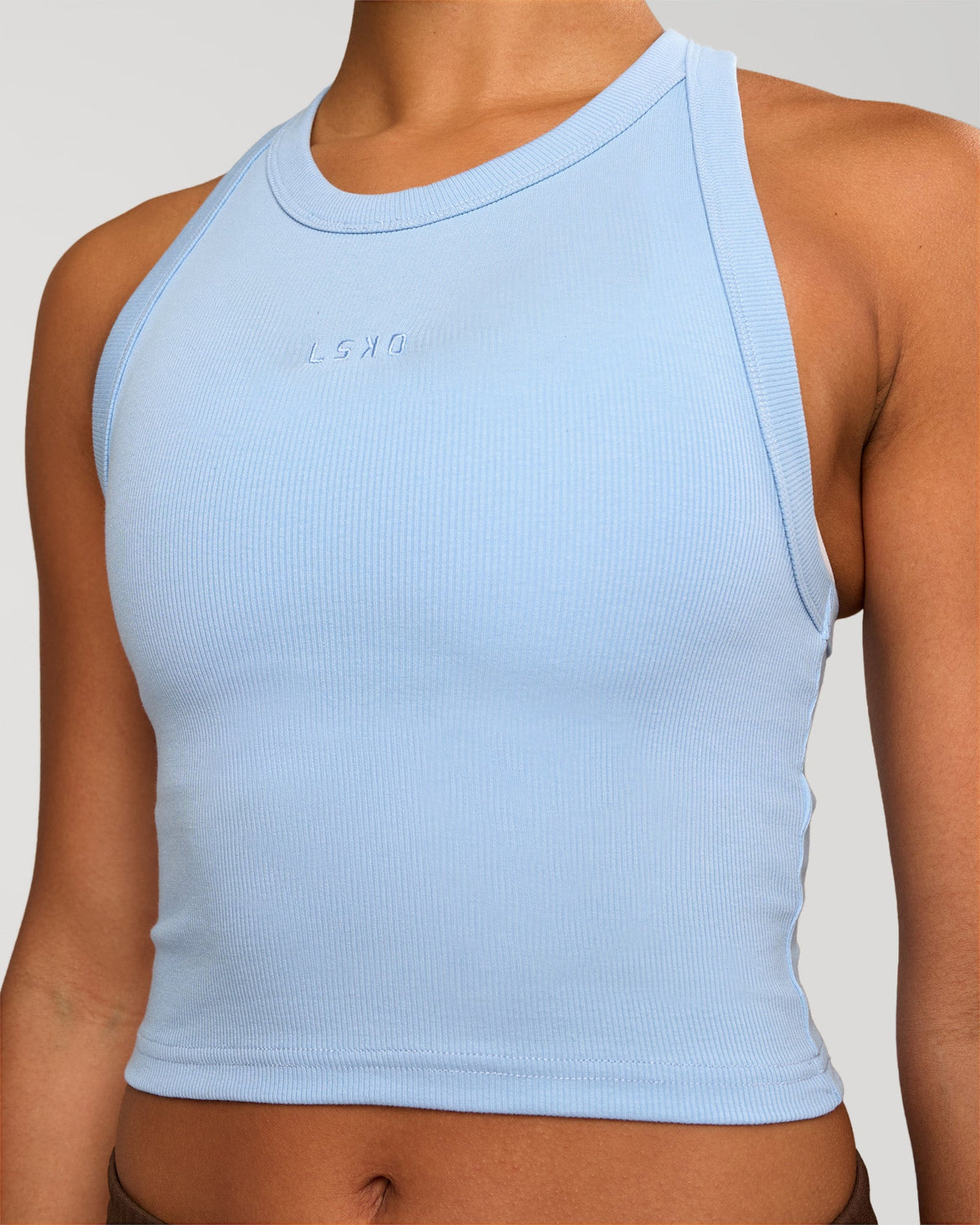 Woman wearing Go-To FLXCotton Rib Crop Tank - Open Air | Model:Rosie | Size:S