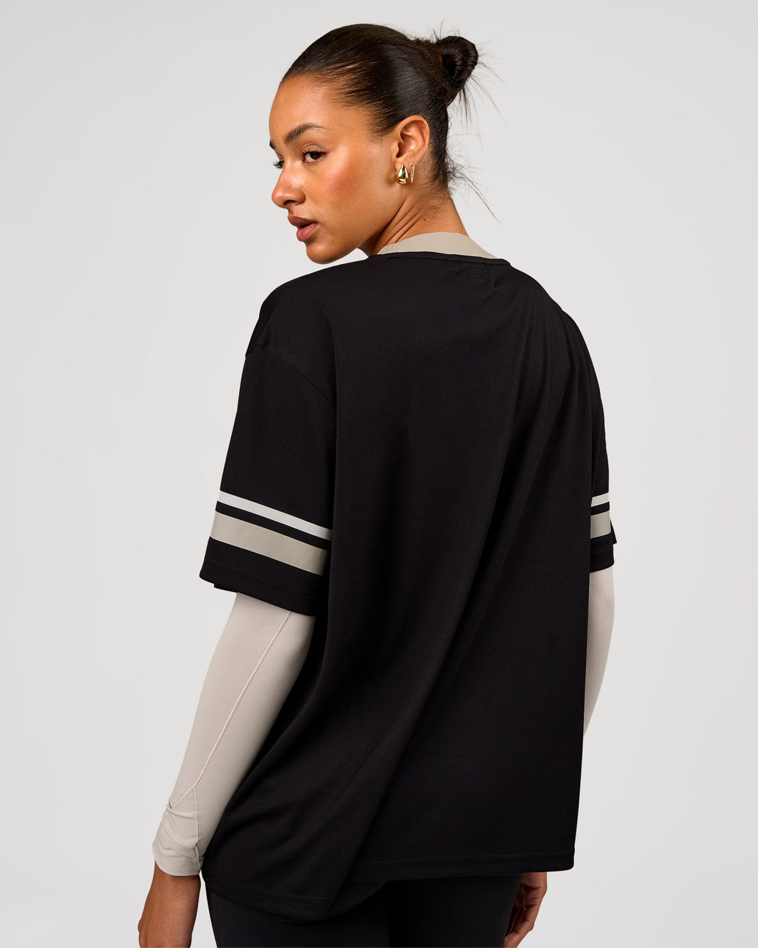 Woman wearing Playmaker V-Neck Jersey - Black-Shale Beige | Model:Rosie | Size:S - view 3