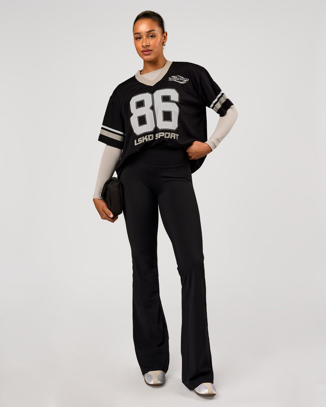 Woman wearing Playmaker V-Neck Jersey - Black-Shale Beige | Model:Rosie | Size:S - view 4