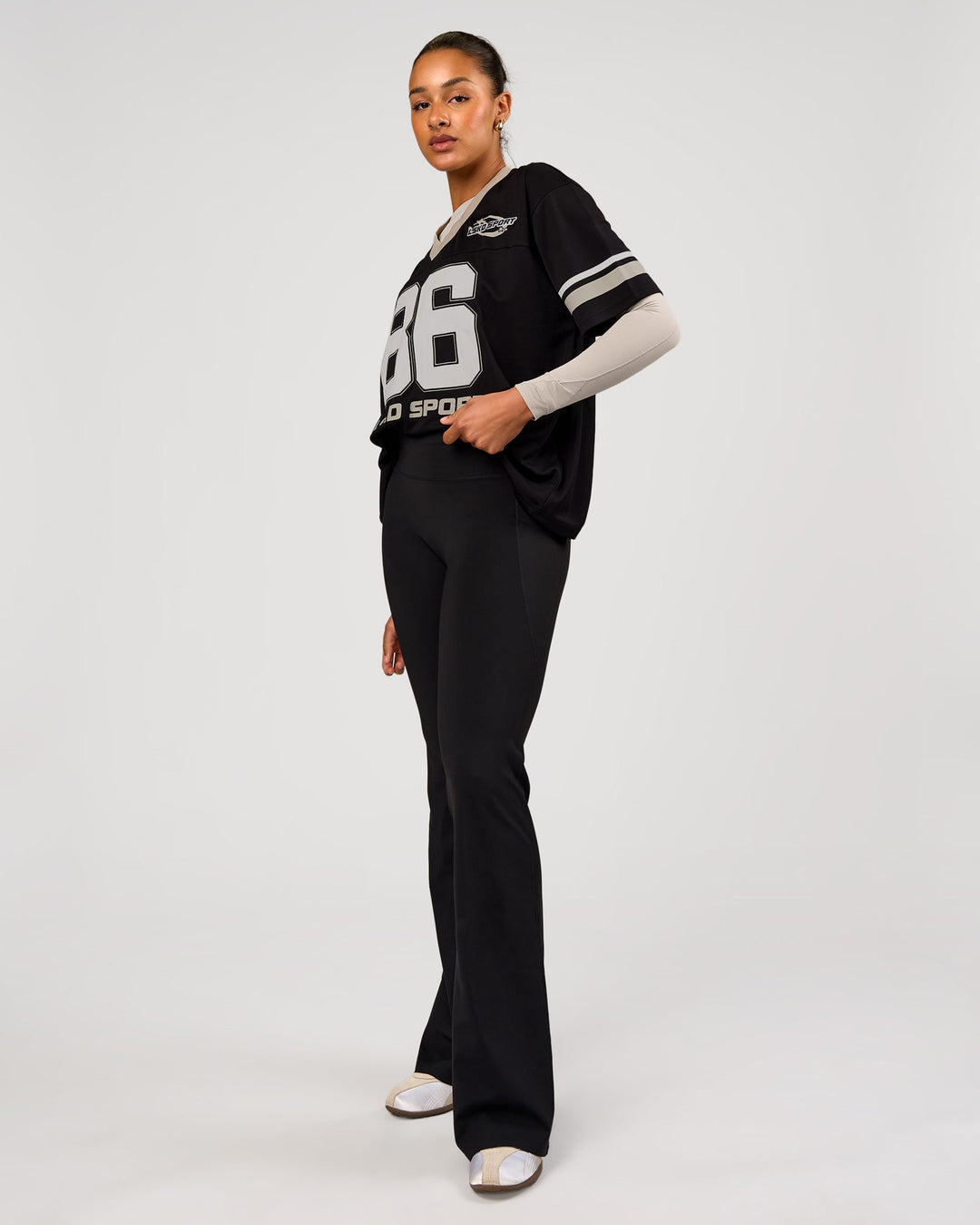 Woman wearing Playmaker V-Neck Jersey - Black-Shale Beige | Model:Rosie | Size:S - view 5