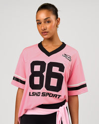 Woman wearing Playmaker V-Neck Jersey - Pink Rose-Black | Model:Rosie | Size:S | Thumbnail Index: 0