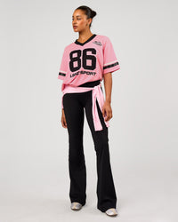 Woman wearing Playmaker V-Neck Jersey - Pink Rose-Black | Model:Rosie | Size:S | Thumbnail Index: 4