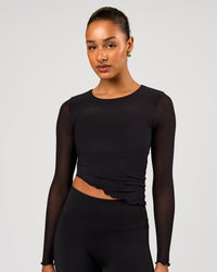 Woman wearing Studio Mesh Asymmetric Long Sleeve - Black | Model:Rosie | Size:S | Thumbnail Index: 1