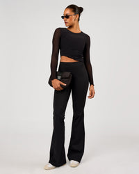 Woman wearing Studio Mesh Asymmetric Long Sleeve - Black | Model:Rosie | Size:S | Thumbnail Index: 4