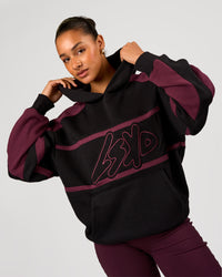 Woman wearing Vibe Oversized Hoodie - Black-Cherry Lacquer | Model:Rosie | Size:S | Thumbnail Index: 6