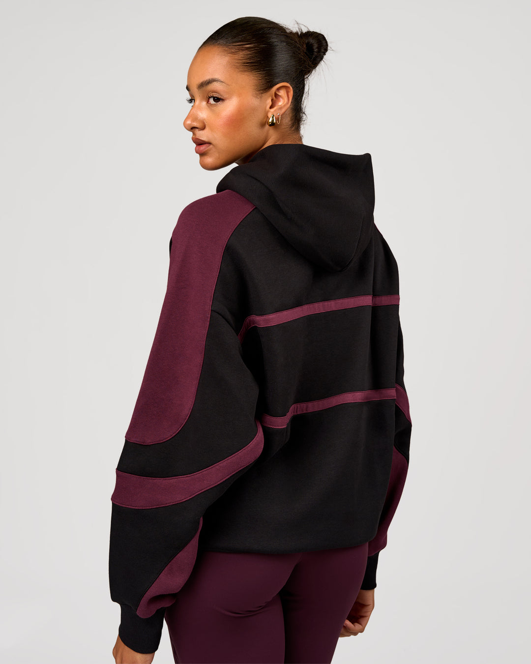 Woman wearing Vibe Oversized Hoodie - Black-Cherry Lacquer | Model:Rosie | Size:S - view 9