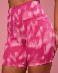 Woman wearing Fusion V-Contour Ultra High-Rise 6" Short Pockets - Radiant Pink | Model:Tianah | Size:S | Thumbnail Index: 1