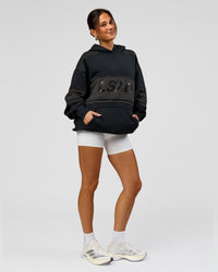 Woman wearing A-Team Oversized Hoodie - Caviar-Onyx | Model:Bianca | Size:XS | Thumbnail Index: 12