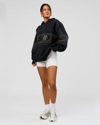Woman wearing A-Team Oversized Hoodie - Caviar-Onyx | Model:Bianca | Size:XS | Thumbnail Index: 14