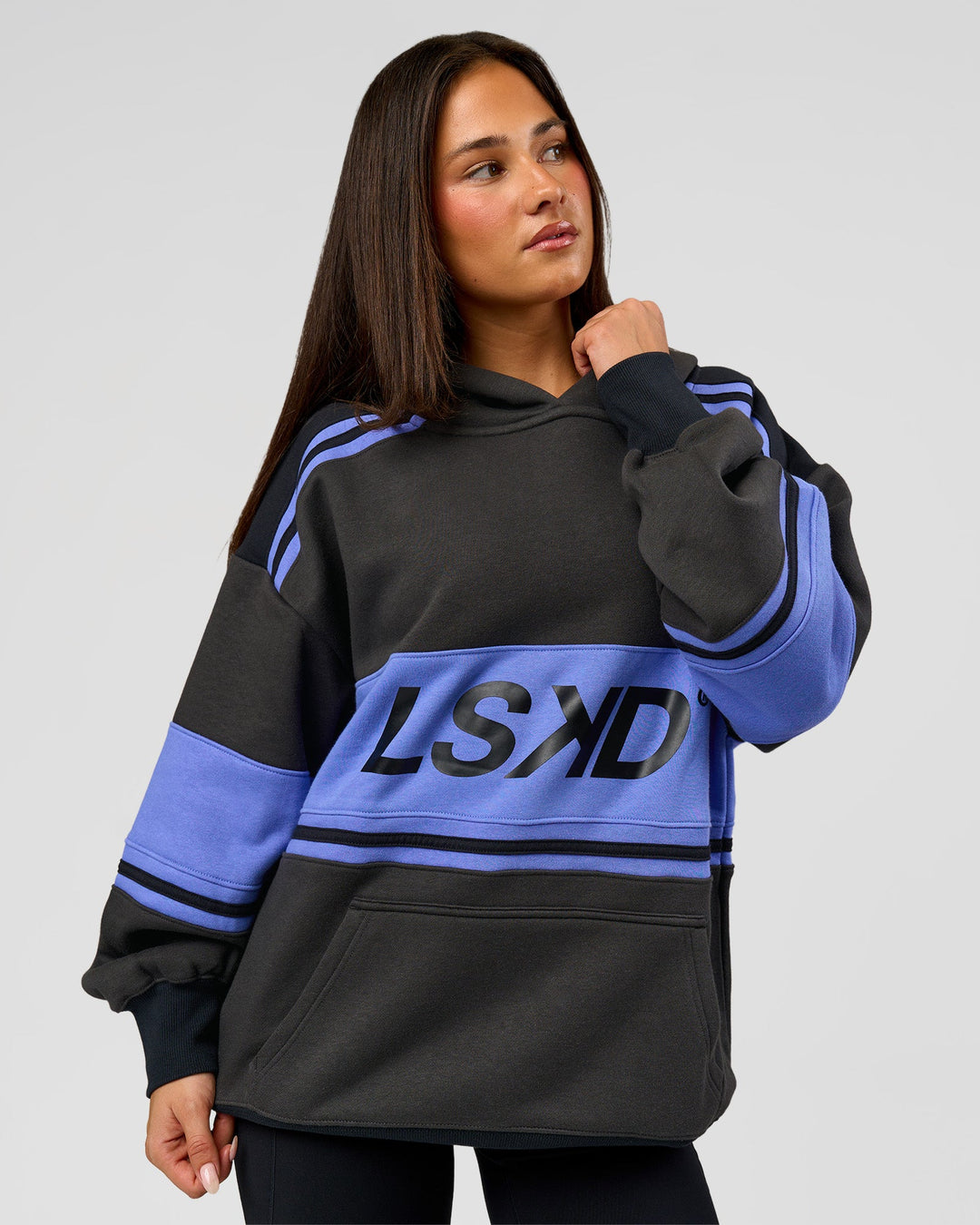 Woman wearing A-Team Oversized Hoodie - Onyx-Bluebell | Model:Bianca | Size:XS - view 5