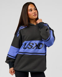 Woman wearing A-Team Oversized Hoodie - Onyx-Bluebell | Model:Bianca | Size:XS | Thumbnail Index: 4