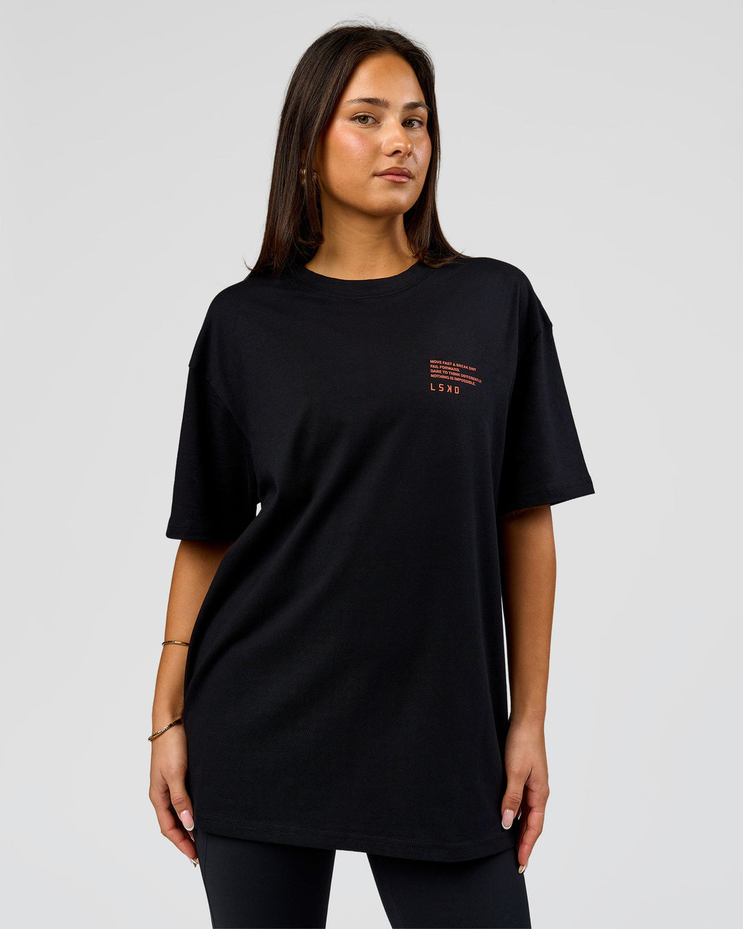 Woman wearing Coffee Run FLXCotton Oversized Tee - Black-Ultra Orange | Model:Bianca | Size:XS - view 6