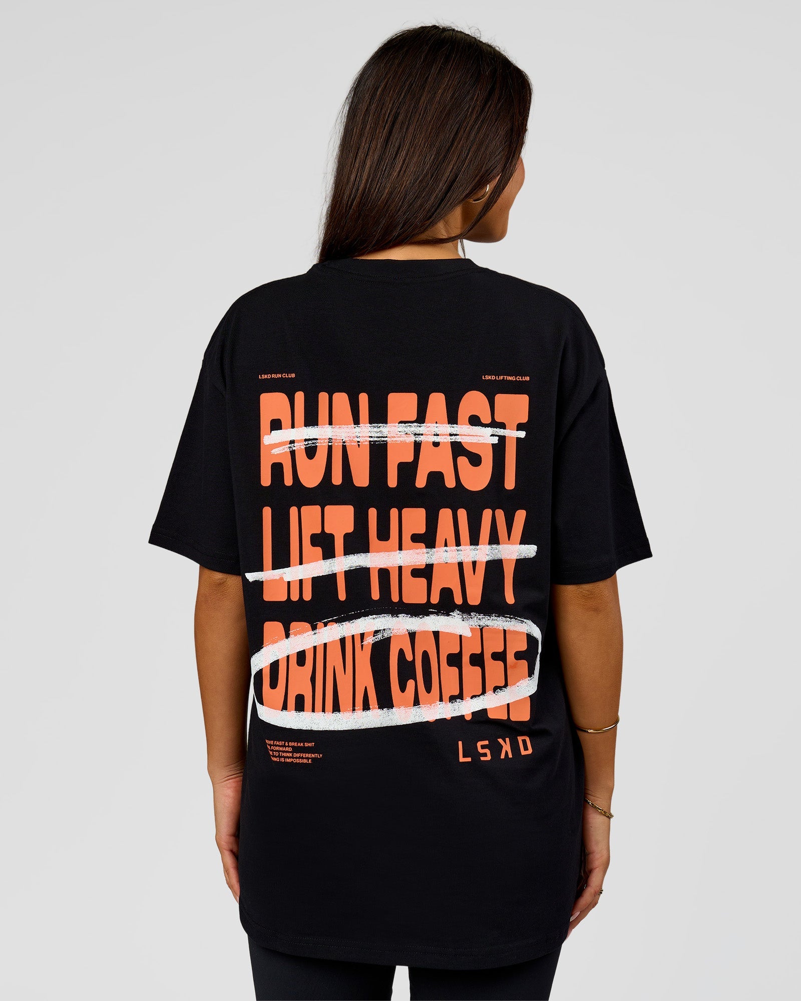 Woman wearing Coffee Run FLXCotton Oversized Tee - Black-Ultra Orange | Model:Bianca | Size:XS