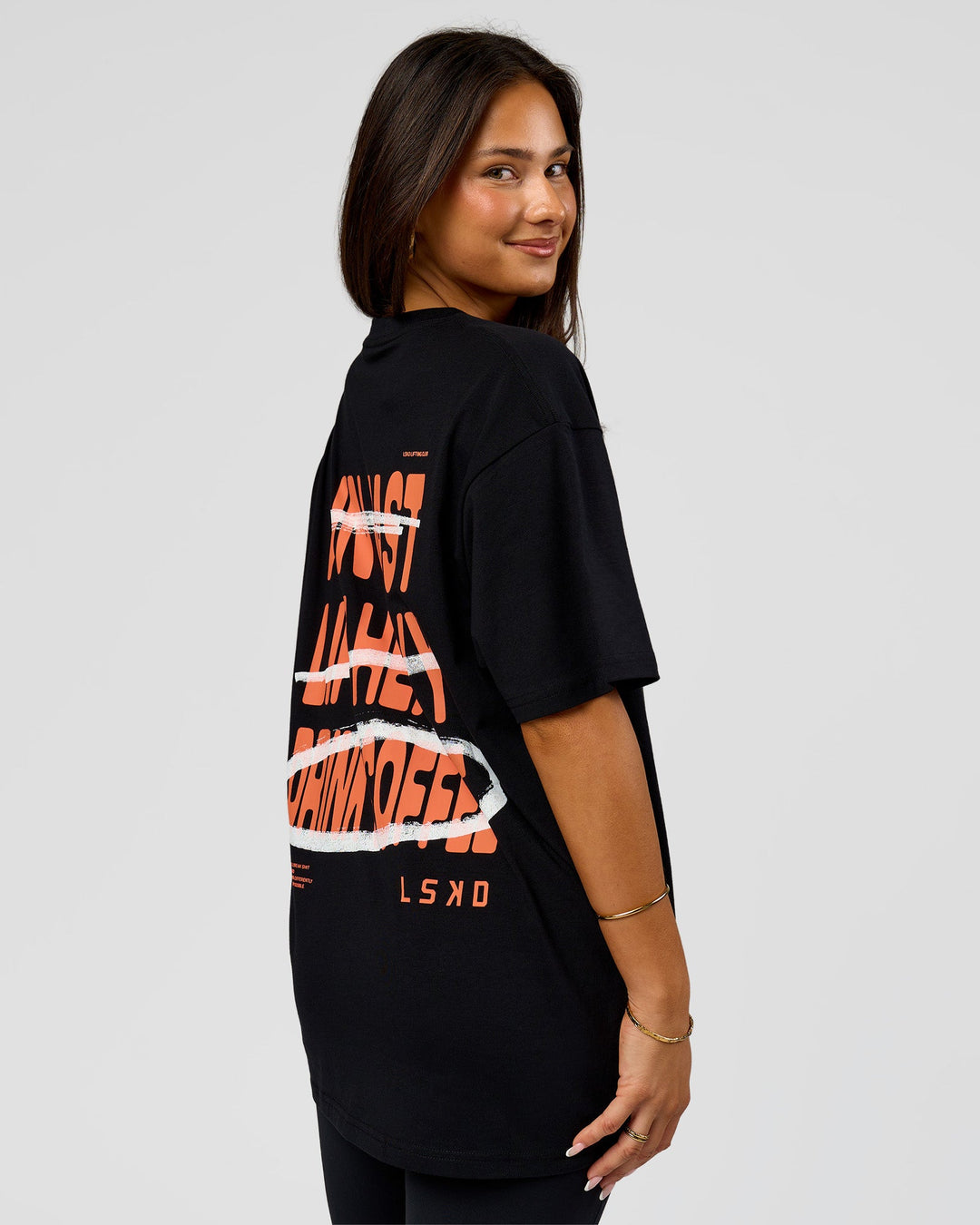 Woman wearing Coffee Run FLXCotton Oversized Tee - Black-Ultra Orange | Model:Bianca | Size:XS - view 7