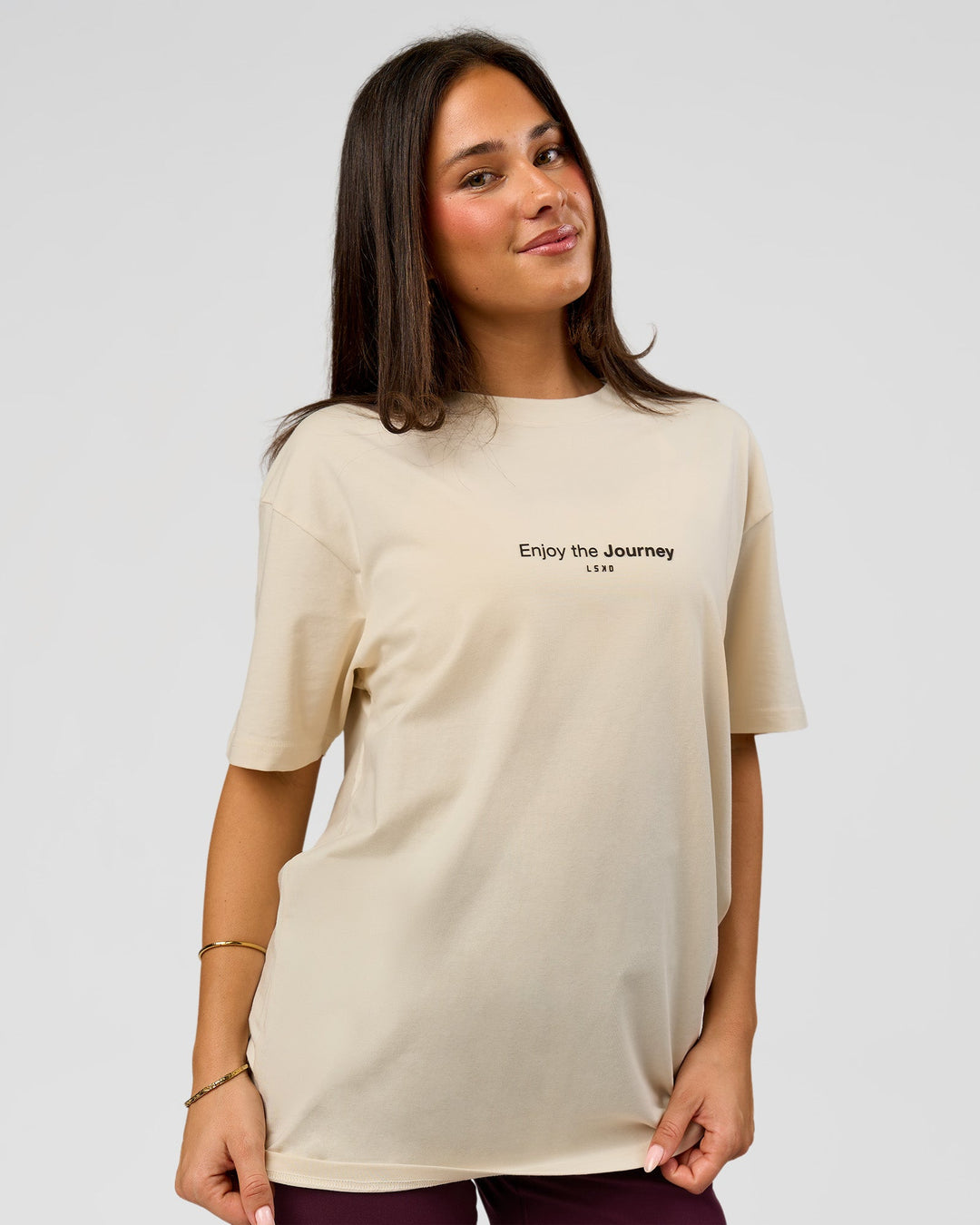 Woman wearing VS1 Enjoy The Journey FLXCotton Oversize Tee - Vanilla Bean | Model:Bianca | Size:XS - view 10