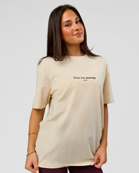Woman wearing VS1 Enjoy The Journey FLXCotton Oversize Tee - Vanilla Bean | Model:Bianca | Size:XS | Thumbnail Index: 9